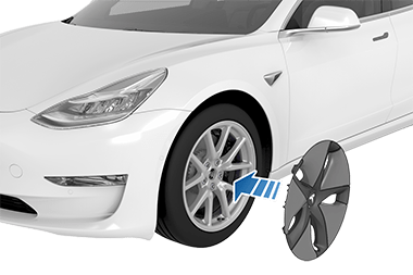 流线型盖上与轮胎的气门杆对齐的 Tesla“T”符号，以及一个从此盖指向轮胎的箭头