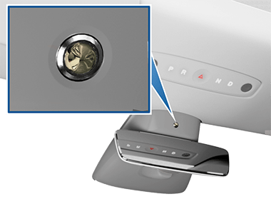 Zoombox with a camera lens, pointing to its location above the rear view mirror